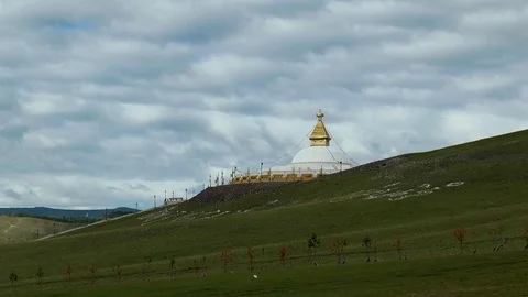 Buddhist stupa under a cloudy picturesque sky, Mongolia. Stock Footage 121876386