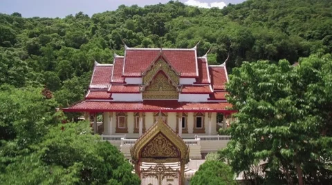 Buddhist Temple and Rainforest Covered Hills in Phuket Thailand Aerial Footage Stock Footage 65458036