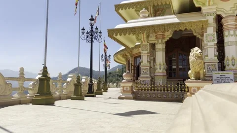 Buddhist Temple Architecture with Flags and Mountain View in Sri Lanka Stock Footage 331666734