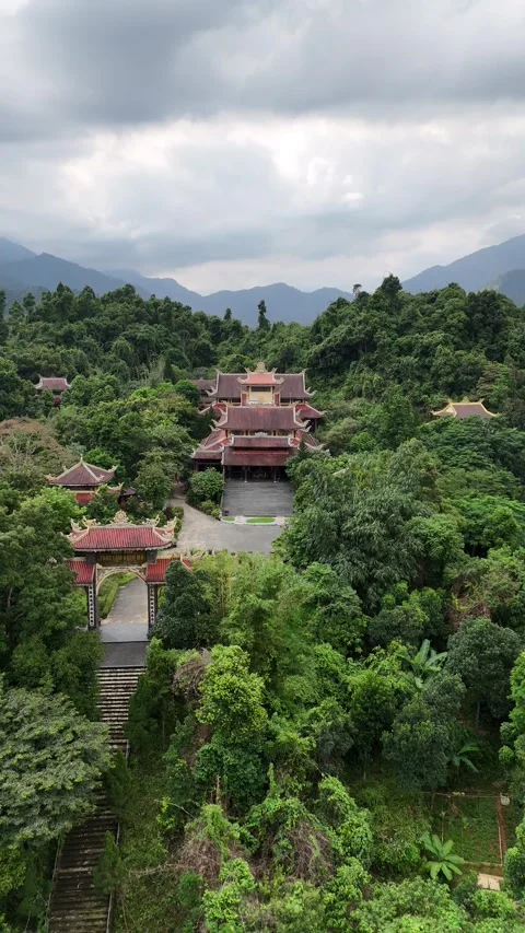 Buddhist Temple Complex in Hue, Vietnam Nestled in Verdant Mountain Forest Stock Footage 335846234