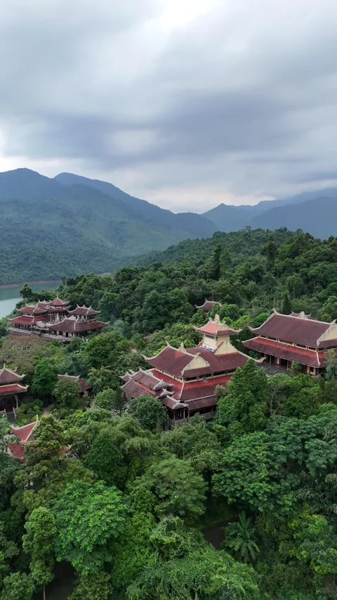 Buddhist Temple Complex in Hue, Vietnam Nestled in Green Mountain Forest Stock Footage 335846256