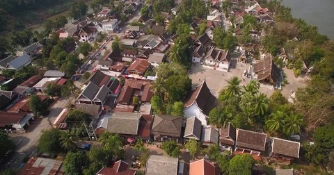 Buddhist Temple Complex in Luang Prabang, Laos, Pullback Drone Shot with Tilt Stock Footage 78486641