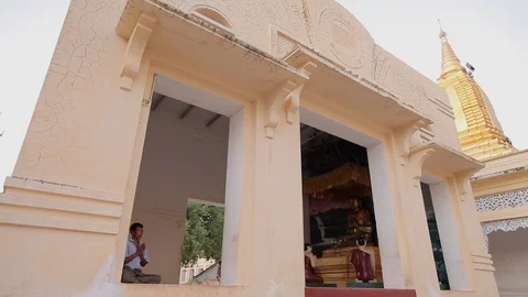 Buddhist temple, man praying, Myanmar Stock Footage 102643840