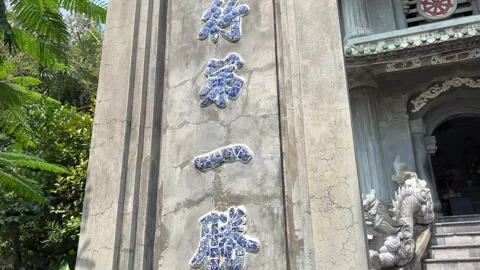 Buddhist temple in Marble Mountain, Da Nang, Vietnam. In front of the entrance Stock Footage 307669781
