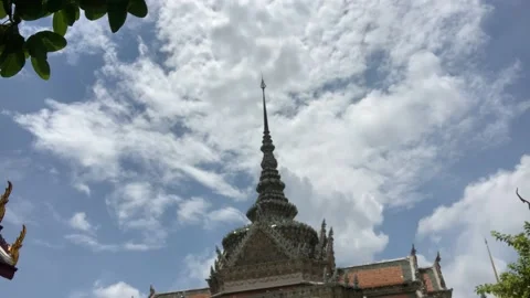Buddhist temple with spire and clouds in time lapse motion Stock Footage 133547771