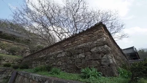 Buddhist temple stone wall tracking shot. Stock Footage 78667472