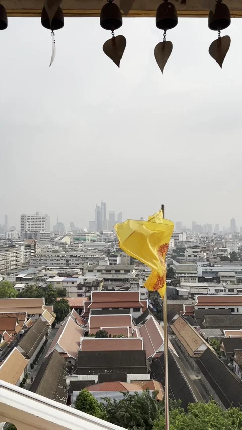 Buddhist Yellow Flag Waving Over Bangkok City Skyline from Thai Temple 스톡 동영상 331678034