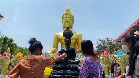 Buddhists bathing a Buddha image during Songkran, Pattaya city, Thailand 4K Stock Footage 179869993