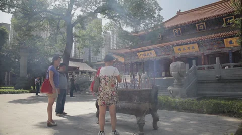Buddhists pray inside the Temple Stock Footage 35787100