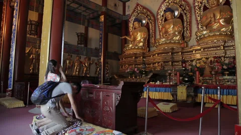 Buddhists pray inside the Temple Stock Footage 35793358
