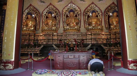 Buddhists pray inside the Temple Stock Footage 35795004