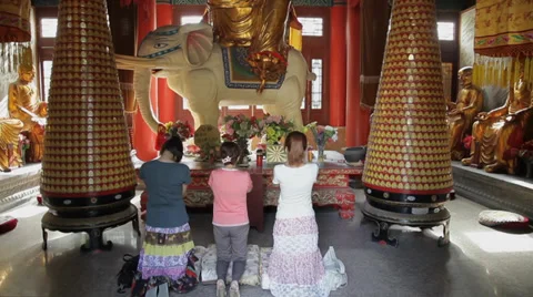 Buddhists pray inside the Temple Stock Footage 35861600