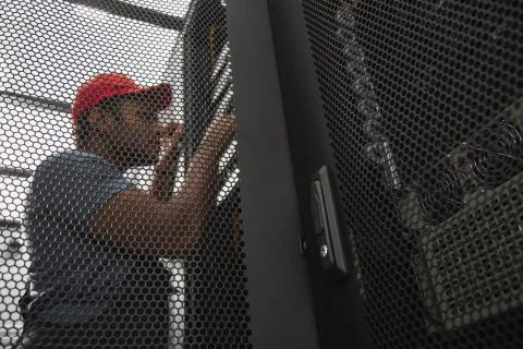 Budding IT engineer overseeing software Stock-Fotos