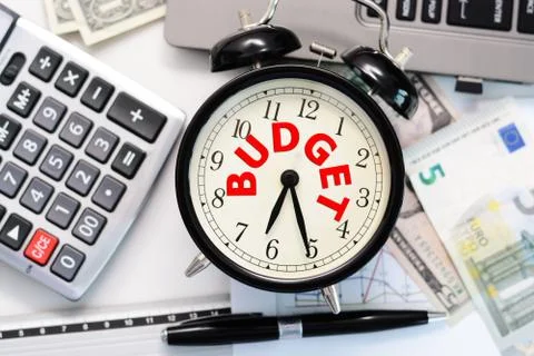 Budget exercise or forecast with old clock concept Fotos Stock