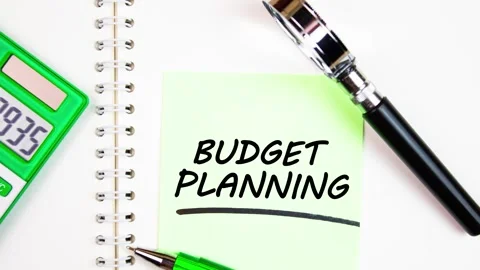 BUDGET PLANNING text,writing a note on a notepad with a calculator,animation. Stock Footage 280188049