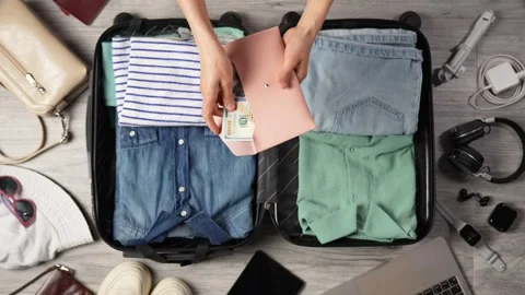 Budget Your Trip Concept. Close-up woman hands counting money and packing s.. Stock Footage 275592745