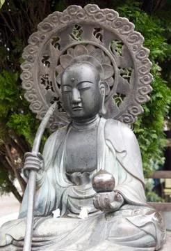 Budha with parasol Stock Photos