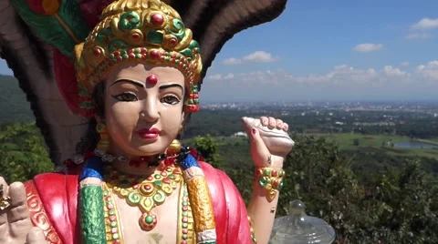 Budhist statue with city in background Stock Footage 43672061