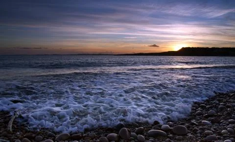 Budliegh beach at sunset Stock Photos