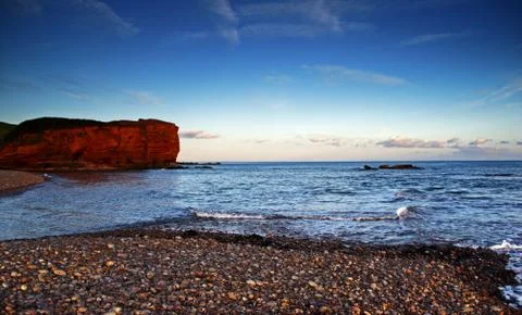 Budliegh beach at sunset Stock Photos