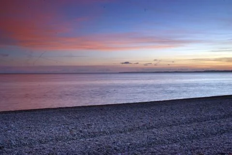 Budliegh beach at sunset Stock Photos