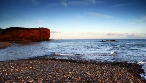 Budliegh beach at sunset Stock Photos
