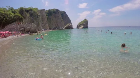 Budva, Montenegro - 28 JUN, 2016: Beach on the island of St. Nicholas. Hawaii Stock Footage 70805715