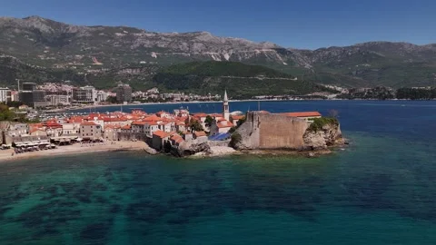 Budva Old Town aerial view with citadel and  Adriatic waters under clear sky Stock Footage 339242956