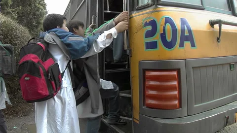 Buenos Aires, Argentina – 2024, Aug 10: Students boarding school bus Stock Footage 341974306