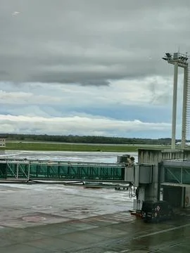 Buenos Aires, Argentina - April 21, 2026: Aircraft and airport terminal fac.. Stockfoto's