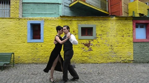 Buenos Aires Argentina La Boca tango dance with couple on street with colors Stock Footage