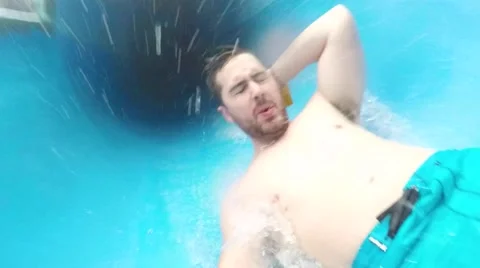 Buff guy exits tunnel slide Stock Footage 63522207