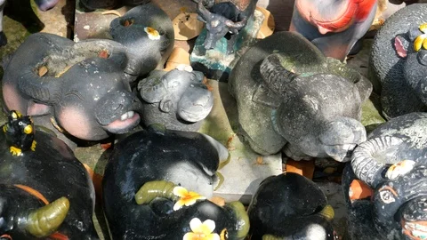 Buffalo figurines displaying on the sidewalk Stock-Footage 119897475