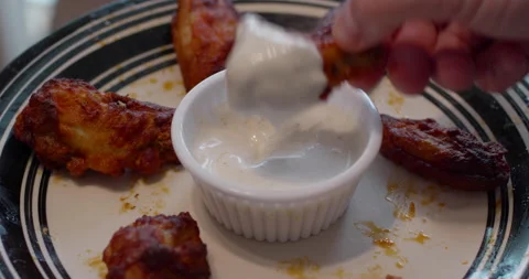 Buffalo Hot Wings dipped in ranch dressing Stock Footage 157841774