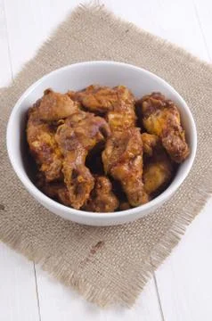 Buffalo style chicken wings in a bowl Stock Photos