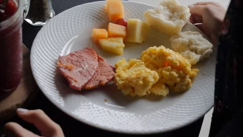 Buffet assortment of jams being put on plate Stock Footage 115732008