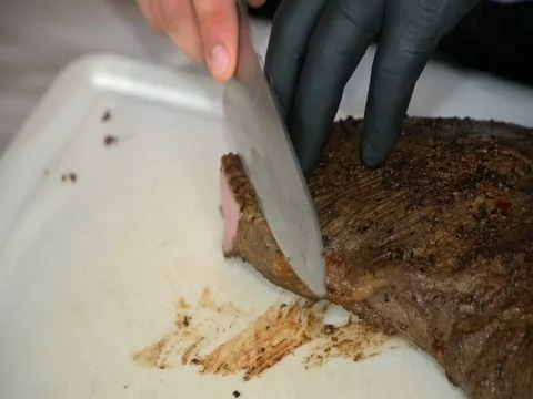 Buffet: the Chef cuts the meat Stock Footage 81559039