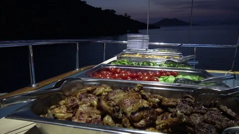 Buffet dinner table set onboard at the sea Stock Footage 112599221