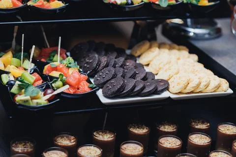 Buffet display features colorful appetizers and snacks Stock Photos