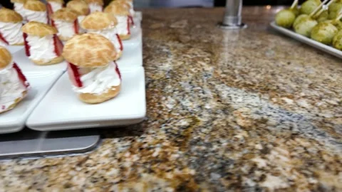 Buffet Display of Puff Pastries and Dessert Treats Stock Footage 318006086
