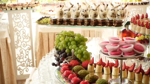 Buffet event. Fruits Cake Dessert with macaroons Stock Footage