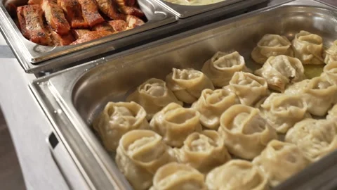 Buffet Food on Catering Table at Dinner Party, Manti food, Backed Salmon, Sauce Stock Footage 295213594