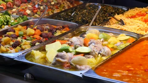 Buffet food display motion of various dishes in serving trays for sale. Stock Footage 332745778