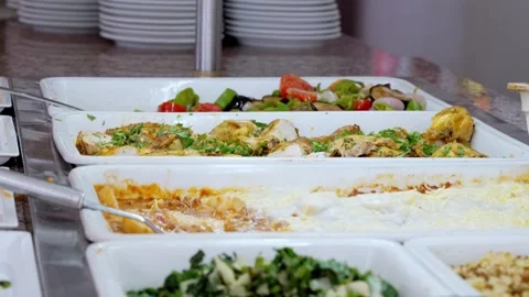 Buffet food service involves people serving themselves from a selfservice line Stockbeeldmateriaal 276420432
