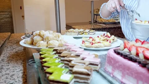 Buffet food service involves people serving themselves from a selfservice line Stockbeeldmateriaal 276420443