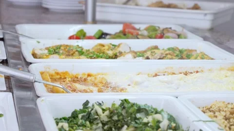 Buffet food service involves people serving themselves from a selfservice line Stockbeeldmateriaal 276420458