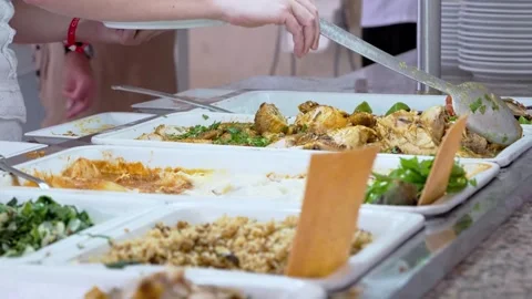 Buffet food service involves people serving themselves from a selfservice line Stockbeeldmateriaal 276420565