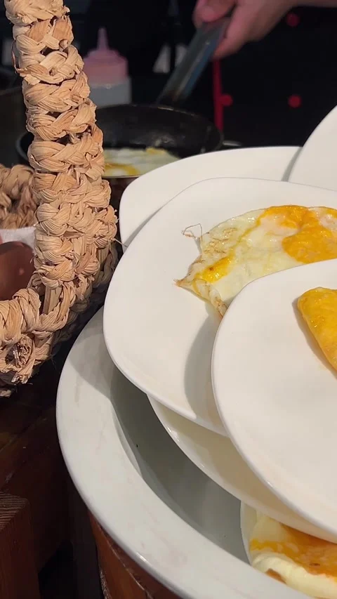 Buffet fried eggs on white plates Delicious breakfast with fried eggs. Top view Stock Footage 316894854