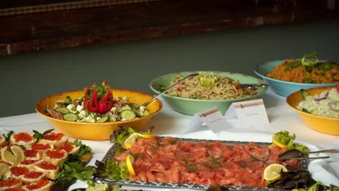 Buffet, guests put food on their plates 스톡 동영상 247684469