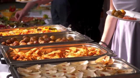 Buffet, guests put food on their plates 스톡 동영상 247684486